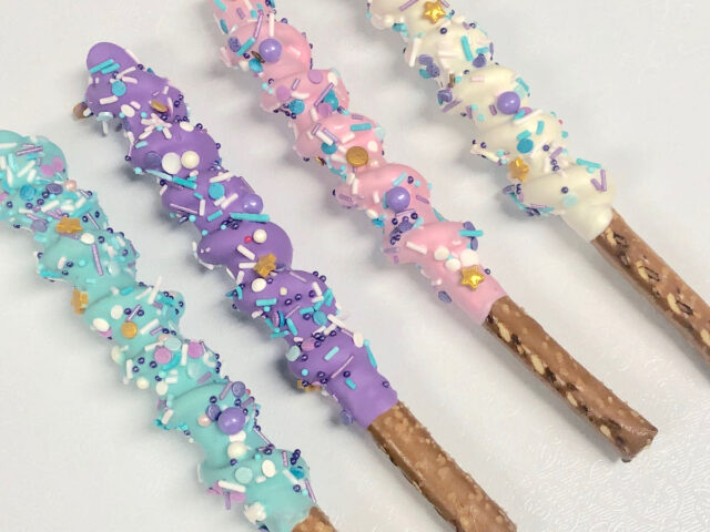 Chocolate dipped pretzel rods decorated with sprinkles